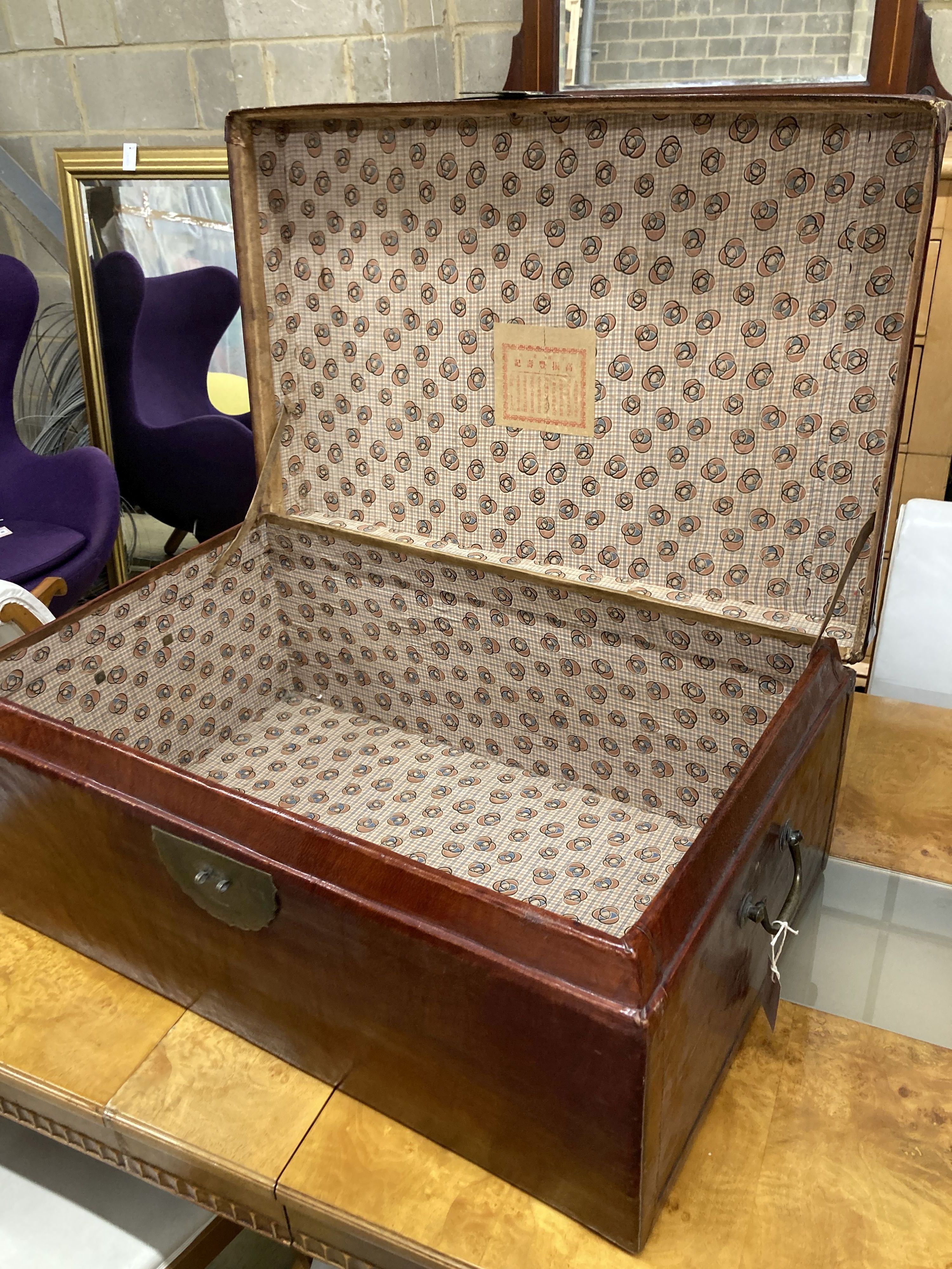 A Chinese leather bound trunk, width 80cm, depth 52cm, height 35cm